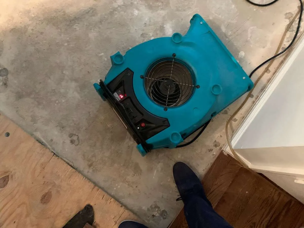 Air mover drying subfloor during Leak Detection & Repair in Mishawaka